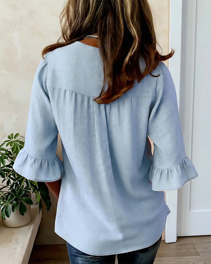 Janet | V-Neck Blouse with Wooden Buttons and Ruffled Sleeves